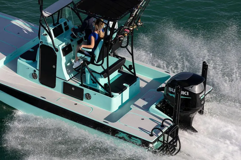 Slide: The Image of Manufacturer Provided Image: 2025 Shallow Sport 25 X3 boat cruising with Suzuki outboard motor in turquoise waters. - 7