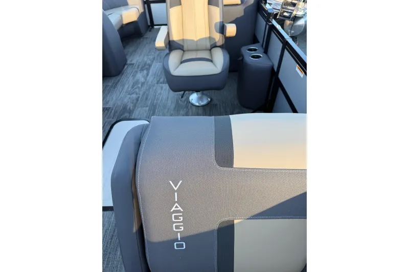 Slide: The Image of Interior of 2026 Viaggio x22u boat with modern seating and cup holders. - 10