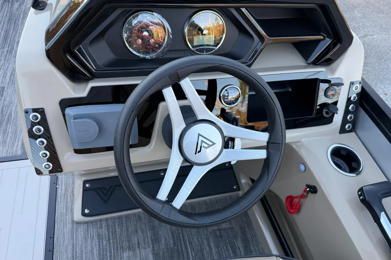 Slide: The Image of Steering wheel and dashboard of 2026 Viaggio x22u boat, featuring modern controls and gauges. - 20