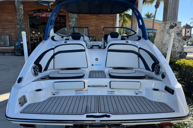 Slide: The Image of 2016 Yamaha Boats 242 Limited S E-Series, rear view, showcasing seating and deck. - 2