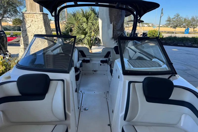 Slide: The Image of 2016 Yamaha Boats 242 Limited S E-Series interior with seating and windshield. - 5