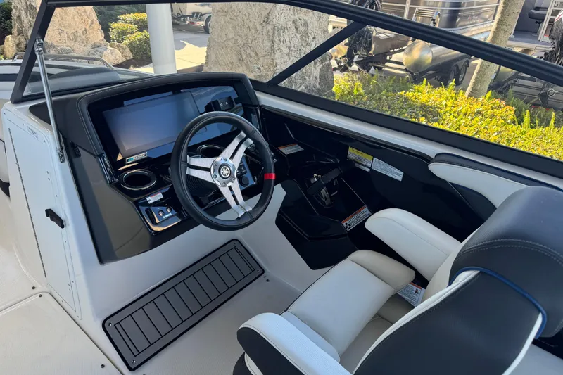 Slide: The Image of 2016 Yamaha Boats 242 Limited S E-Series cockpit with steering wheel and control panel. - 7