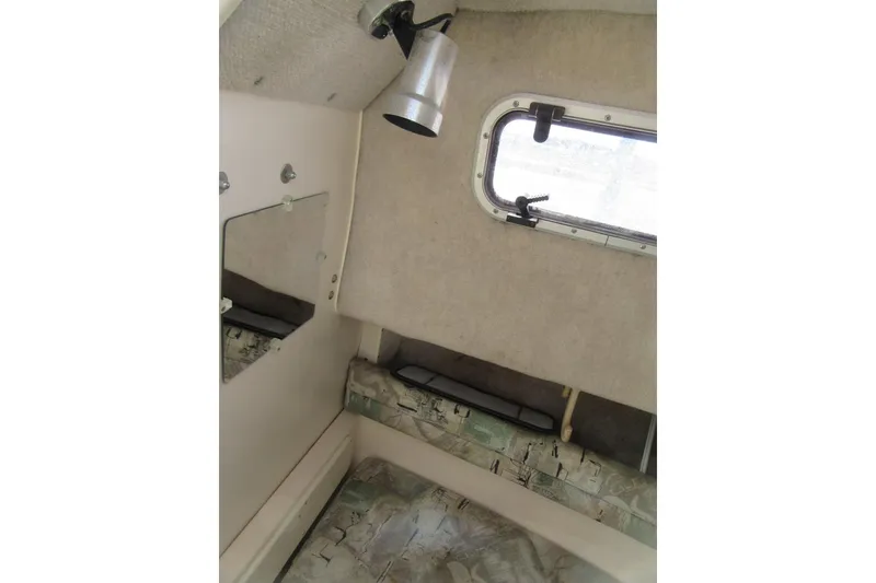 Slide: The Image of Interior cabin of 1996 Grady-White Voyager 248 boat with window and light fixture. - 16