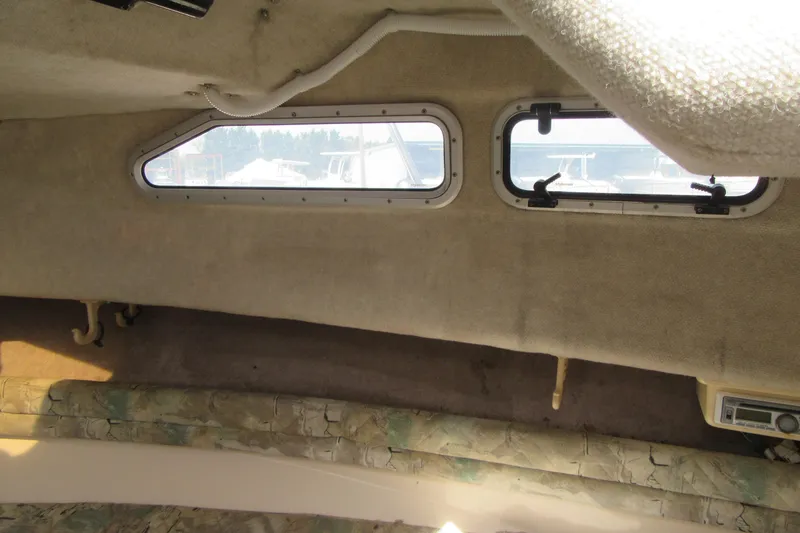Slide: The Image of Interior cabin of a 1996 Grady-White Voyager 248 boat with windows and seating. - 20