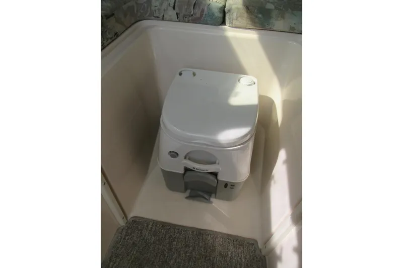 Slide: The Image of Portable toilet inside 1996 Grady-White Voyager 248 boat cabin. - 24