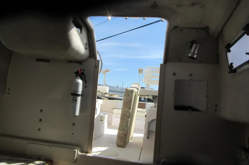 Slide: The Image of Interior view of 1996 Grady-White Voyager 248 boat, featuring cabin details and equipment. - 25