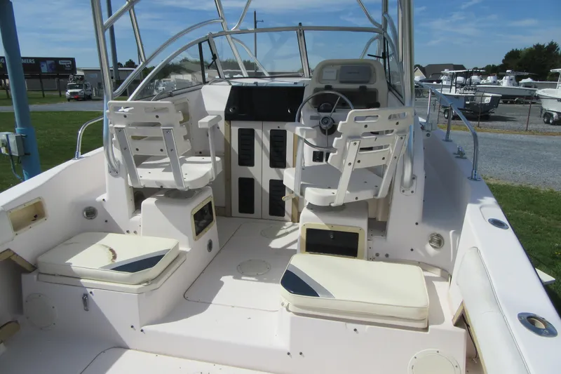 Slide: The Image of 1996 Grady-White Voyager 248 boat interior with dual helm seats and spacious deck. - 32