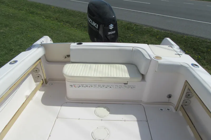 Slide: The Image of 1996 Grady-White Voyager 248 boat interior with seating and Suzuki 300 outboard motor. - 38