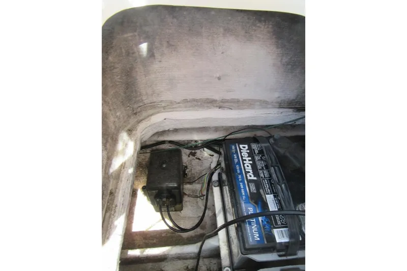 Slide: The Image of Battery compartment of a 1996 Grady-White Voyager 248 with DieHard Platinum battery. - 40