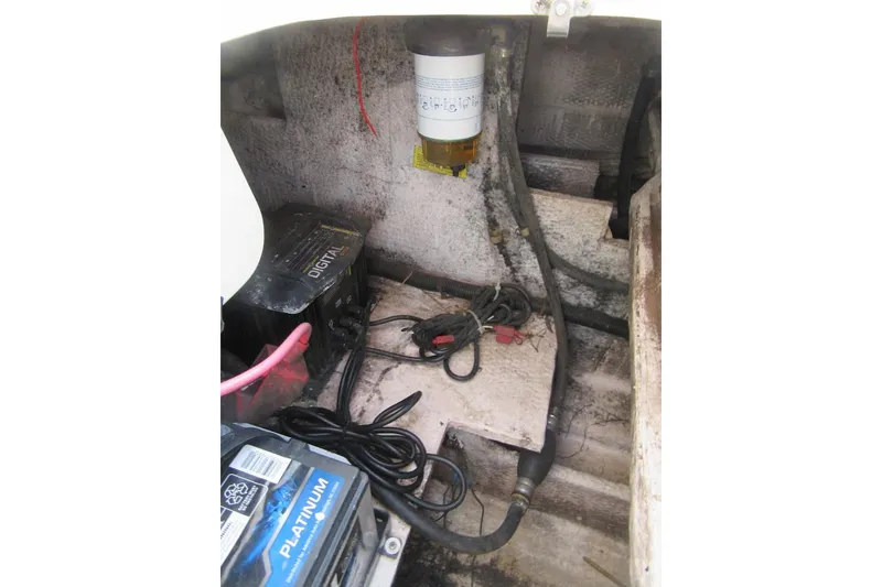 Slide: The Image of Engine compartment of a 1996 Grady-White Voyager 248 boat, showing battery and wiring. - 41