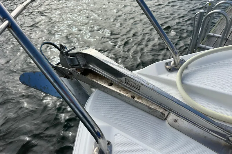 Slide: The Image of Bow of 2005 Carver 36 Super Sport with anchor and railing over water. - 17