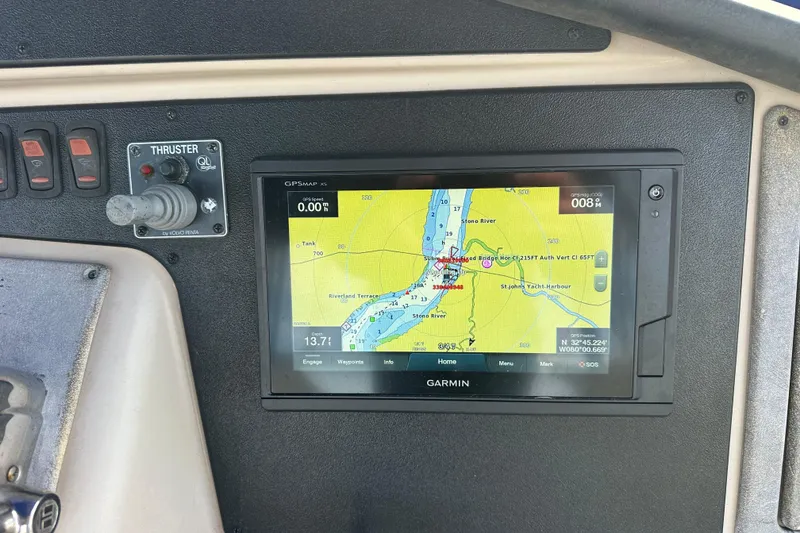Slide: The Image of Garmin GPS display and thruster control on 2005 Carver 36 Super Sport boat dashboard. - 22
