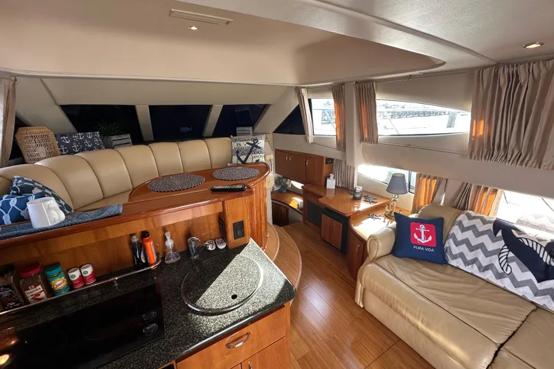 Slide: The Image of Luxurious interior of 2005 Carver 36 Super Sport yacht with elegant seating and decor. - 26