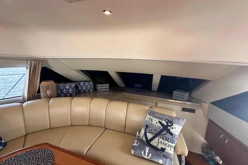 Slide: The Image of Interior of 2005 Carver 36 Super Sport yacht with beige seating and nautical decor. - 33