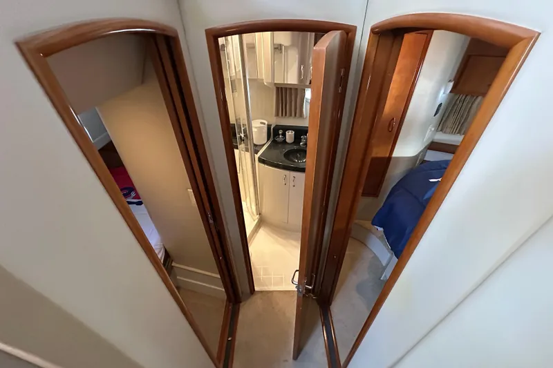 Slide: The Image of Interior view of 2005 Carver 36 Super Sport yacht, featuring bathroom and cabin areas. - 38