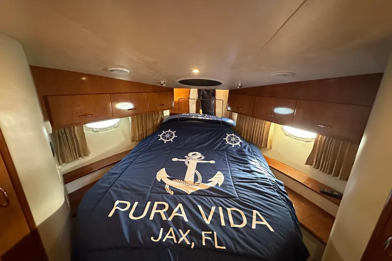Slide: The Image of Luxurious cabin interior of 2005 Carver 36 Super Sport yacht with nautical bedding. - 39