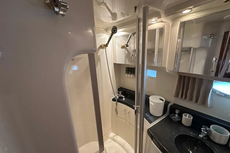 Slide: The Image of Bathroom interior of 2005 Carver 36 Super Sport yacht, featuring shower and sink area. - 43