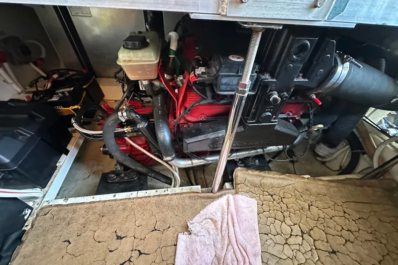 Slide: The Image of Engine compartment of a 2005 Carver 36 Super Sport boat, showing mechanical components. - 49