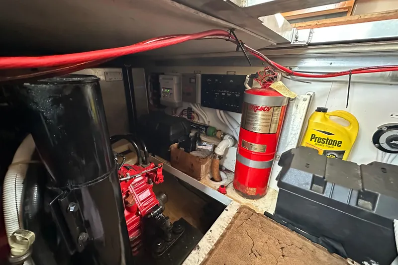 Slide: The Image of Engine room of a 2005 Carver 36 Super Sport with fire extinguisher and coolant container. - 51