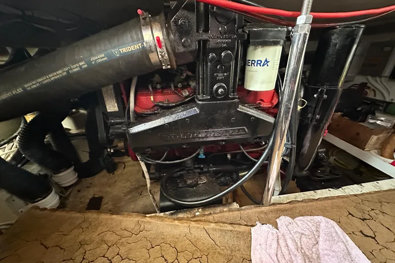 Slide: The Image of Engine compartment of a 2005 Carver 36 Super Sport boat, featuring Volvo Penta components. - 53