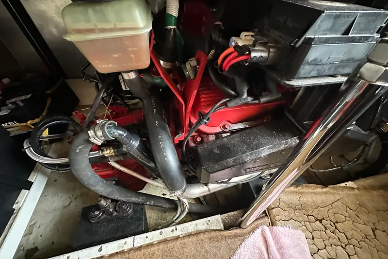 Slide: The Image of Engine compartment of a 2005 Carver 36 Super Sport boat, showing hoses and components. - 54