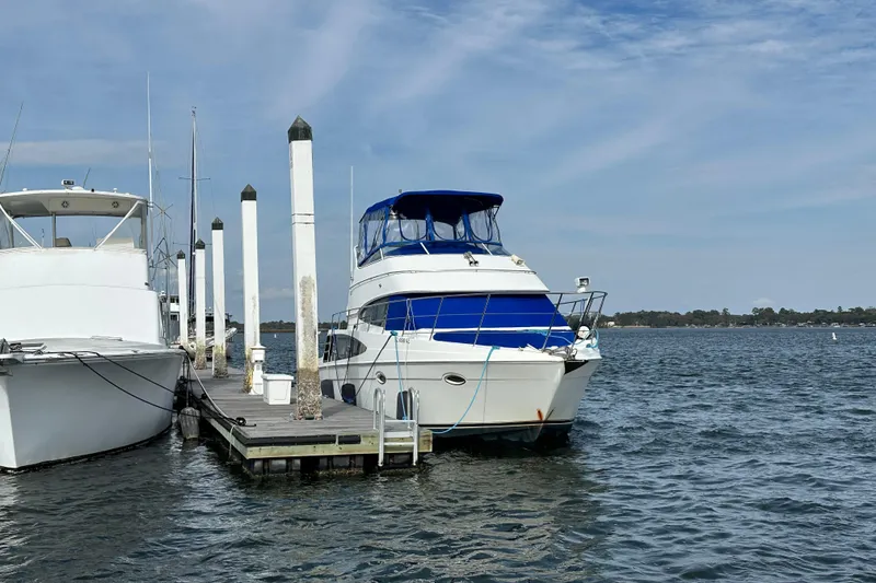 Slide: The Image of 2005 Carver 36 Super Sport yacht docked at marina on a sunny day. - 6