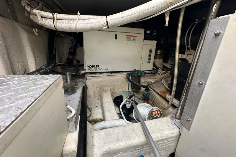 Slide: The Image of Engine room of 2005 Carver 36 Super Sport with Kohler power systems. - 63