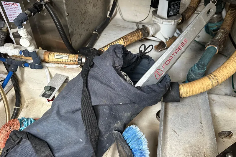 Slide: The Image of Engine room of 2005 Carver 36 Super Sport with tools and hoses. - 65