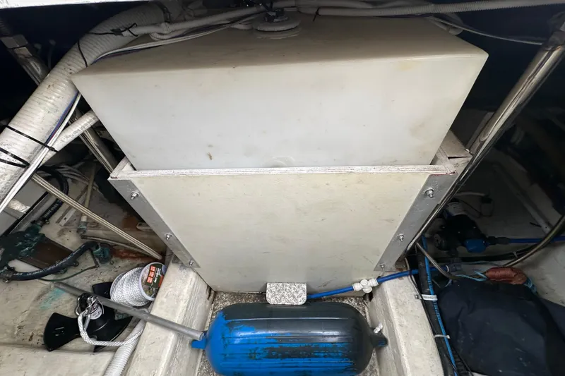 Slide: The Image of Engine compartment of a 2005 Carver 36 Super Sport boat, showing equipment and wiring. - 67