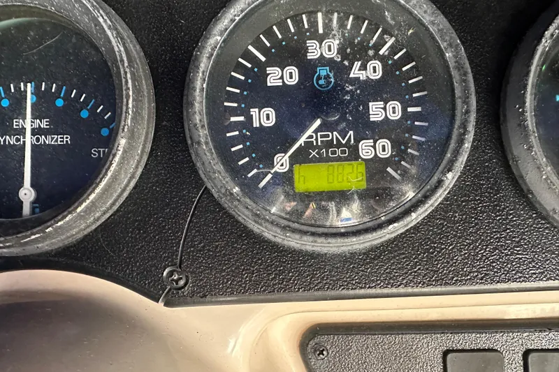 Slide: The Image of Close-up of 2005 Carver 36 Super Sport boat tachometer and engine synchronizer gauges. - 69