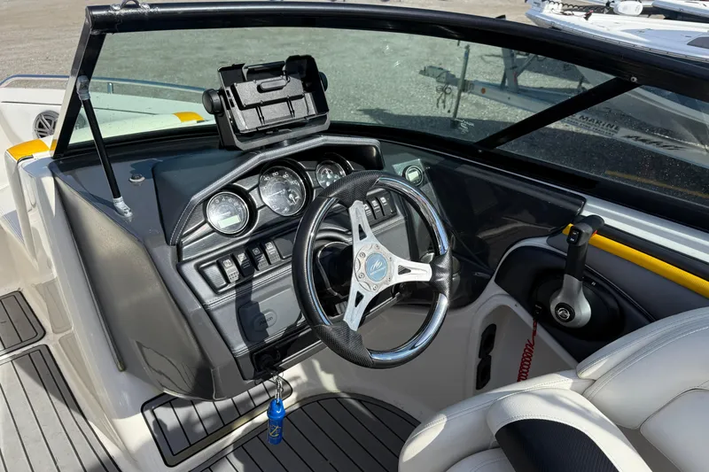 Slide: The Image of 2014 Monterey 197 Blackfin boat dashboard with steering wheel and controls. - 11