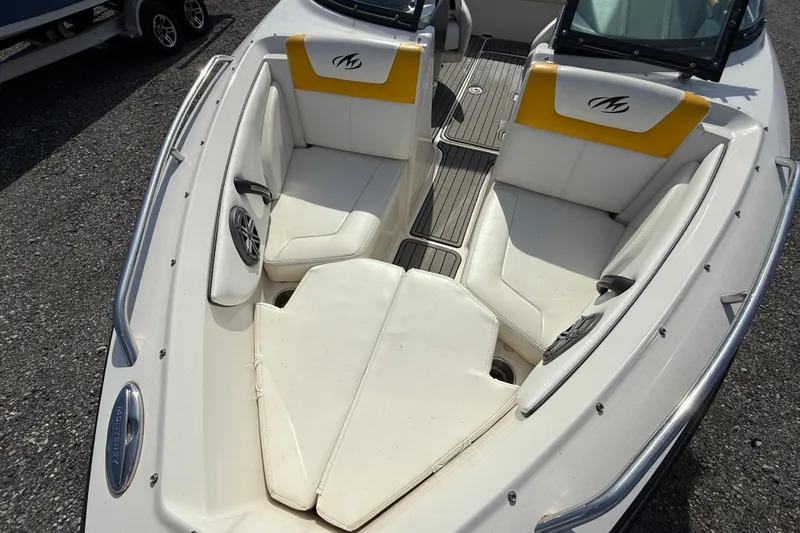 Slide: The Image of 2014 Monterey 197 Blackfin boat interior with white and yellow seating. - 14