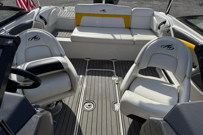 Slide: The Image of Interior of a 2014 Monterey 197 Blackfin boat with white seating and gray flooring. - 19