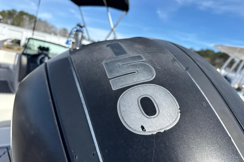 Slide: The Image of 2014 Monterey 197 Blackfin boat engine close-up with "150" marking. - 25