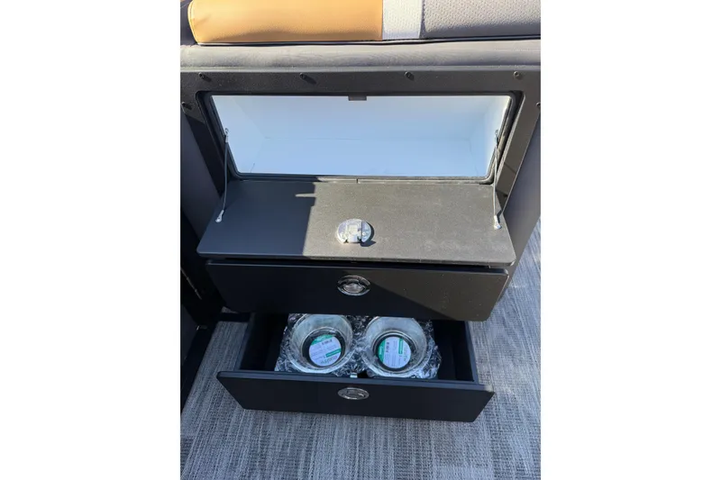 Slide: The Image of Interior storage compartments of 2026 Viaggio X22Q boat, featuring open drawers with packaged items. - 14