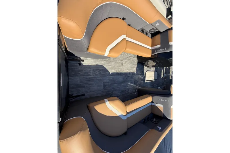Slide: The Image of Luxurious interior of 2026 Viaggio X22Q with tan and gray seating. - 18