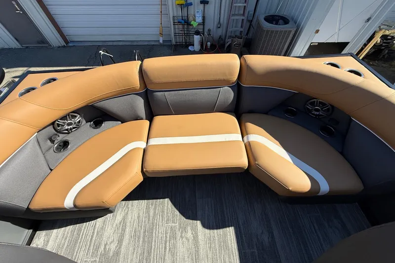 Slide: The Image of Luxurious seating on 2026 Viaggio X22Q boat with cup holders and speakers. - 24