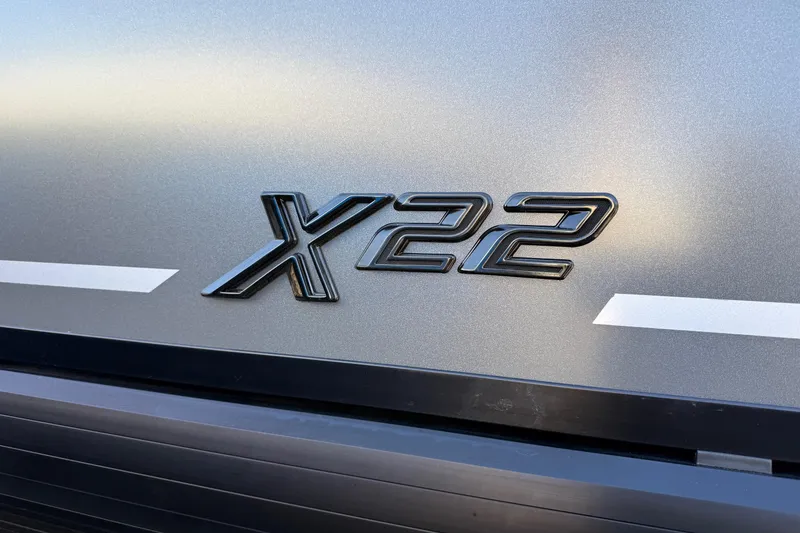 Slide: The Image of 2026 Viaggio X22Q emblem on sleek metallic surface. - 27