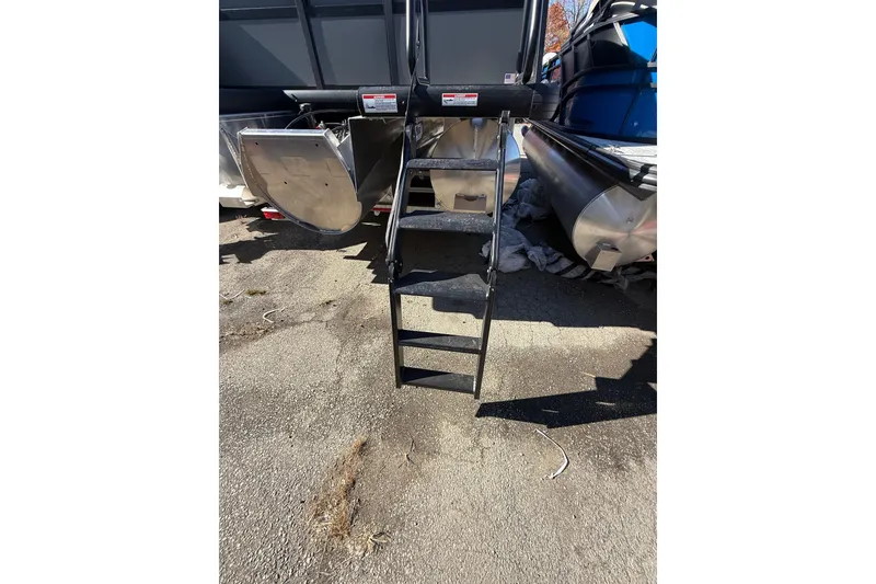 Slide: The Image of Rear view of 2026 Viaggio X22Q boat with ladder and pontoons. - 30