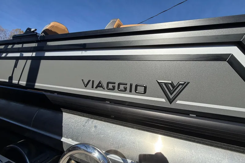 Slide: The Image of 2026 Viaggio X22Q boat with sleek design and logo under clear blue sky. - 35