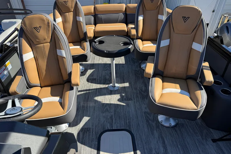 Slide: The Image of Luxurious interior of 2026 Viaggio X22Q boat with tan leather seating and central table. - 6