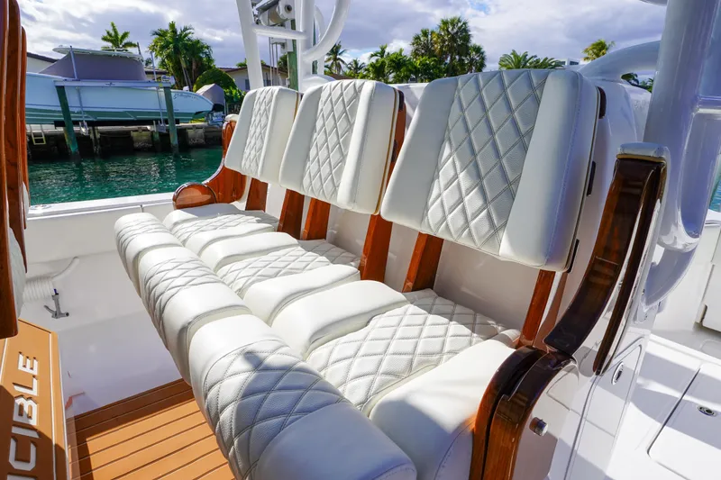 Slide: The Image of Aerial view of 2024 Invincible 43 Open Fisherman docked by a poolside. - 13