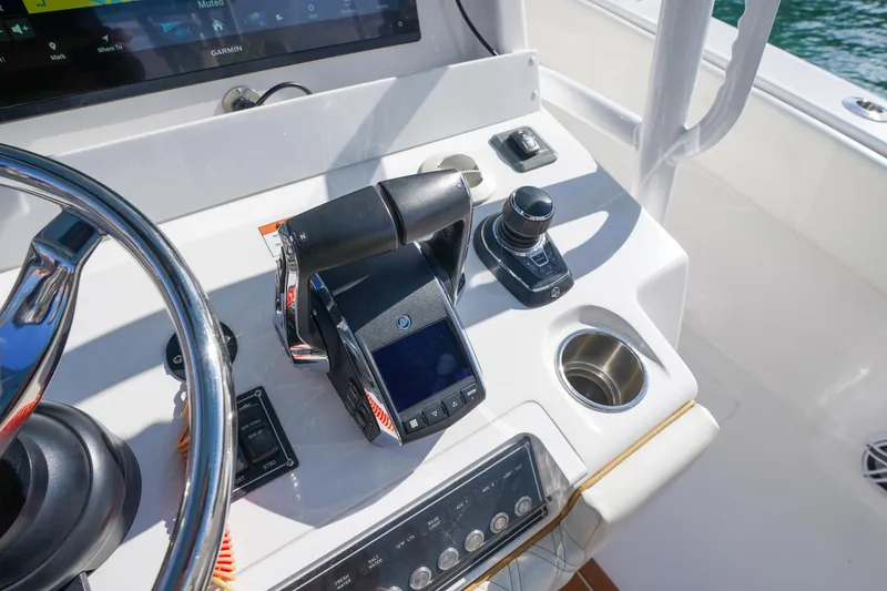 Slide: The Image of 2024 Invincible 43 Open Fisherman boat interior with rod holders and live wells. - 18
