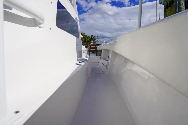 Slide: The Image of 2024 Invincible 43 Open Fisherman boat interior with storage compartments and cup holders. - 22