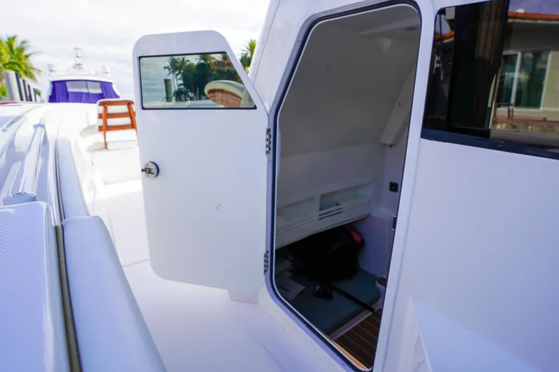 Slide: The Image of 2024 Invincible 43 Open Fisherman boat interior with luxurious seating and navigation screens. - 23