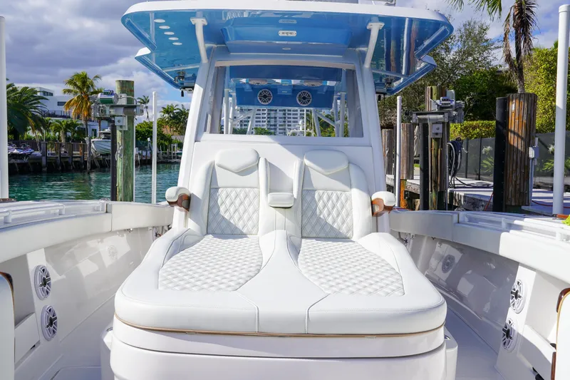 Slide: The Image of 2024 Invincible 43 Open Fisherman boat interior with cup holders and seating. - 26
