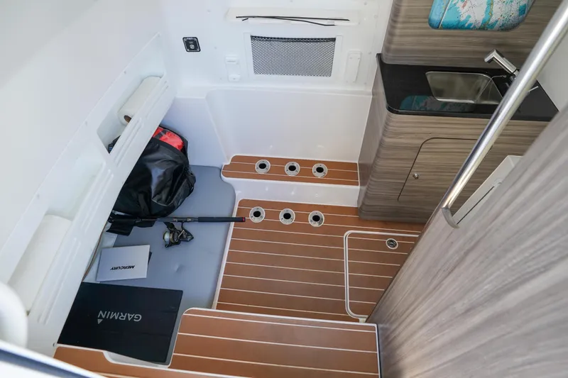 Slide: The Image of 2024 Invincible 43 Open Fisherman helm with controls and Garmin display. - 29