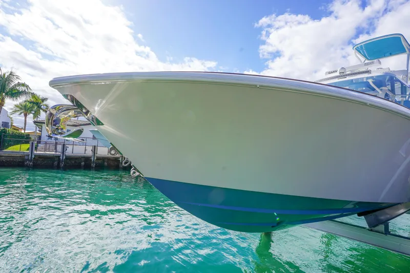 Slide: The Image of 2024 Invincible 43 Open Fisherman boat with luxurious seating and advanced navigation equipment. - 39