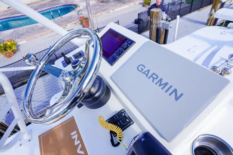 Slide: The Image of 2024 Invincible 43 Open Fisherman helm with Garmin navigation system. - 48