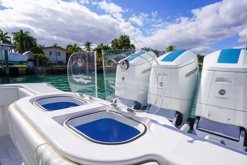 Slide: The Image of 2024 Invincible 43 Open Fisherman boat docked, showcasing sleek design and spacious deck. - 9